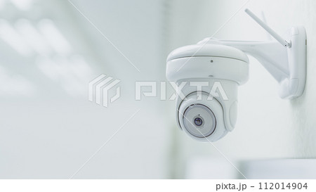 Cctv Security Camera Installed in white room or laboratory. Can be used in technology background or security work. Cctv Security Camera Installed in white room or laboratory. Can be used in technology background or security work. 112014904