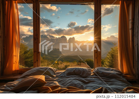 Open eco-lodge hotel room with mountain view at sundown Open eco-lodge hotel room with mountain view at sundown 112015484