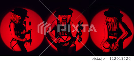 Sexy submissive woman girl in underwear with handcuffs and a flogger whip for BDSM sex with submission and domination 112015526