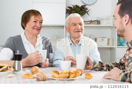Parents and son enjoying evening 112016115