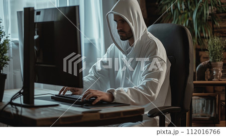 A virologist dressed in a white protective suit A virologist dressed in a white protective suit 112016766