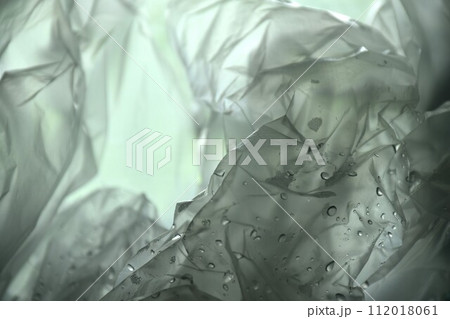 white plastic bag packing stacking with drop of water background and texture 112018061
