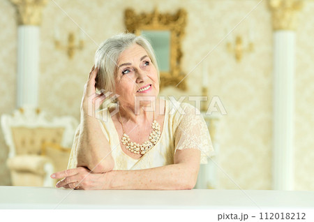 Portrait of beautiful happy senior woman posing 112018212