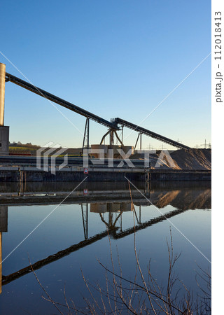 Riverside Manufacturing Hub. Eco-Friendly Technology and Production. industry and the environment, showcasing the integration of sustainable practices. 112018413