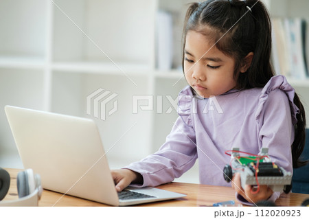 STEM education concept. Asian young girl learning robot design. STEM education concept. Asian young girl learning robot design. 112020923