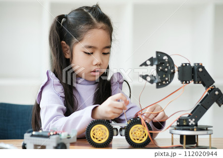 STEM education concept. Asian young girl learning robot design. STEM education concept. Asian young girl learning robot design. 112020944