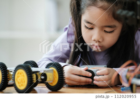 STEM education concept. Asian young girl learning robot design. STEM education concept. Asian young girl learning robot design. 112020955