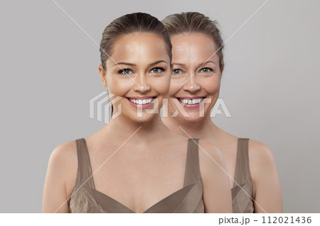 Happy joyful healthy young and senior woman smiling on white background. Aging, cosmetology 112021436