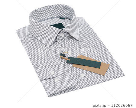White folded men's shirt with polka dots in black color isolated on white background White folded men's shirt with polka dots in black color isolated on white background 112026067