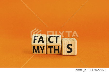 Facts or myths symbol. Concept word Myths and Facts. Beautiful orange table orange background. Business and facts or myths fact myth concept. Copy space. Facts or myths symbol. Concept word Myths and Facts. Beautiful orange table orange background. Business and facts or myths fact myth concept. Copy space. 112027078