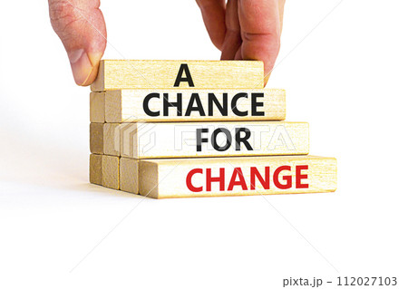 A chance for change symbol. Concept words A chance for change on beautiful wooden block. Beautiful white table white background. Voter hand. Business A chance for change concept. Copy space. 112027103
