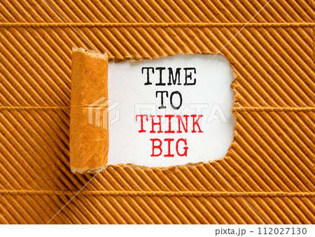 Time to think big symbol. Concept words Time to think big on beautiful white paper. Beautiful brown background. Business and time to think big concept. Copy space. 112027130