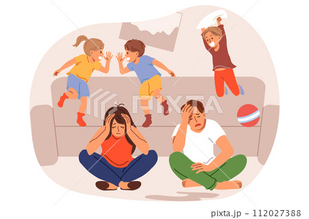 Frustrated parents feel tired and lacking energy due to hyperactive children jumping on sofa 112027388