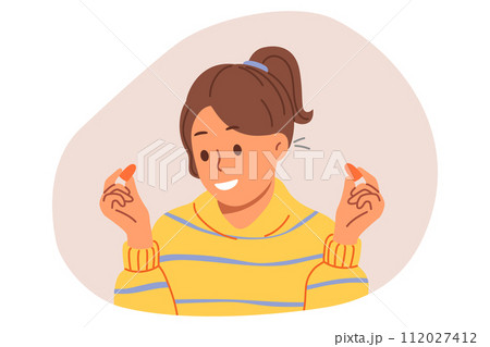 Woman uses earplugs to block out noise from neighbors so can concentrate or sleep 112027412