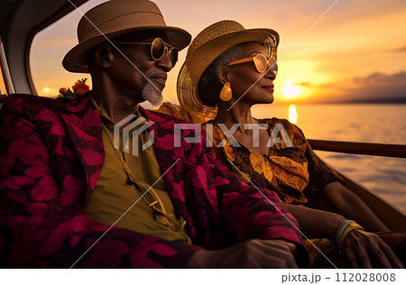 Vibrant Senior Couple Enjoying a Sunset Cruise. Black History Month concept Vibrant Senior Couple Enjoying a Sunset Cruise. Black History Month concept 112028008