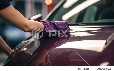 Hand with microfiber cloth polishing car Hand with microfiber cloth polishing car 112028458