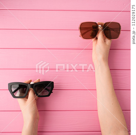 Summer abstract background mockup template woman hands hold Couple sunglasses fashionable Summer abstract background mockup template woman hands hold Couple sunglasses fashionable 112029175