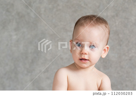 Shirtless kid with surprise on his face 112030203