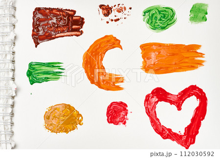 Brush strokes, drops of multi-colored oil paint on a white background 112030592