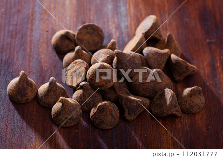 Chocolate candies truffles on dark table Chocolate candies truffles on dark table 112031777