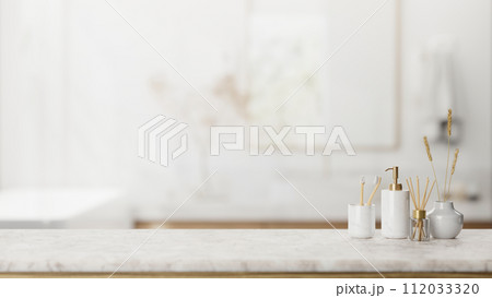 A presentation space on a luxury white marble table features toiletries in an elegant bathroom. A presentation space on a luxury white marble table features toiletries in an elegant bathroom. 112033320