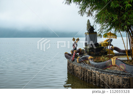 Spiritual shrine in Pura Ulan Danu Bratan temple at the shore of lake Bratan the second largest lake in Bali, Indonesia in the morning. 112033328