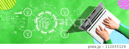 Idea light bulb theme with person using a laptop 112035129