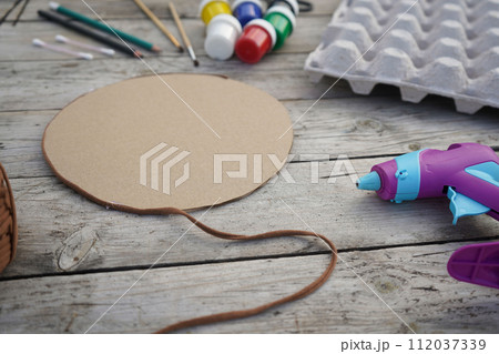 Step by step instructin. DIY flowers and lady bug from recycling egg boxes. Zero waste concept. 112037339