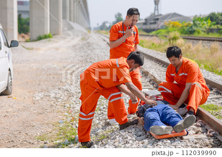 paramedic,medical,emergency,doctor,team,working,in,action,help,first,aid,save,people,life,at,accident,site,outdoors 112039990