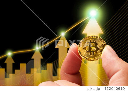 Bitcoin or cryptocurrency prices rise up positive, golden coin holding in a hand with up arrow chart 112040610