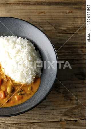 豚肉、かぼちゃ、人参などの野菜が沢山入ったカレーライス 豚肉、かぼちゃ、人参などの野菜が沢山入ったカレーライス 112042641