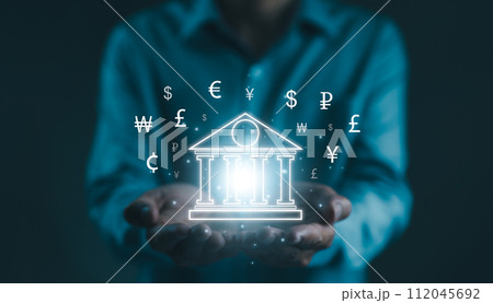 Businessman holding virtual world. dollar yuan yen euro ruble and pound sterling sign. world economy, business money transfer, Central bank online, interbank payment, Global currency exchange concept. Businessman holding virtual world. dollar yuan yen euro ruble and pound sterling sign. world economy, business money transfer, Central bank online, interbank payment, Global currency exchange concept. 112045692