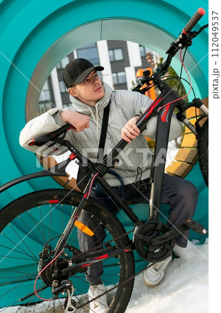 European man sitting and resting between bike rides 112049537