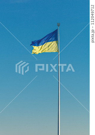 Ukrainian flag against the blue sky Ukrainian flag against the blue sky 112049712