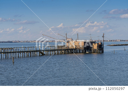 the wooden fishermen's shacks in the Comacchio valley the wooden fishermen's shacks in the Comacchio valley 112050297
