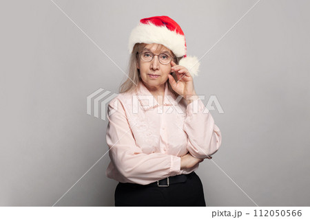 Grandma in Santa hat, Christmas portrait Grandma in Santa hat, Christmas portrait 112050566