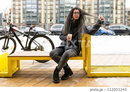 Urban pretty woman with bicycle in winter 112051243
