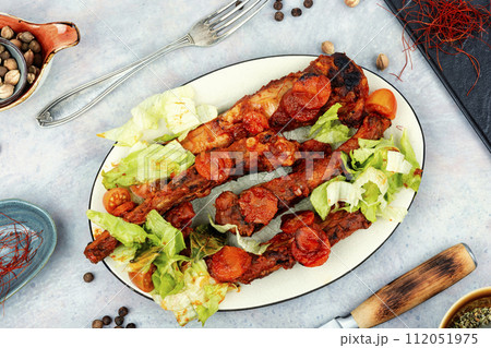 Tasty stewed pork ribs in sauce. Tasty stewed pork ribs in sauce. 112051975