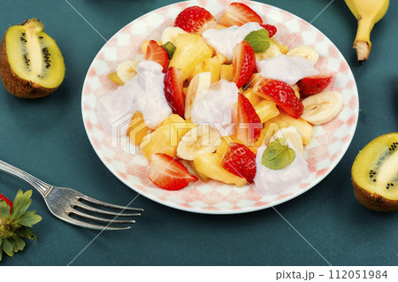 Delicious fruit salad with yogurt. Delicious fruit salad with yogurt. 112051984