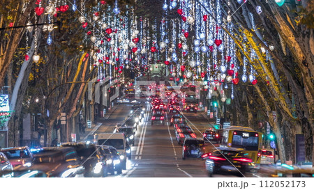 Avenida da Liberdade in Lisbon illuminated with lights hanging from the trees night timelapse. Portugal 112052173