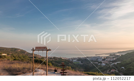 Panorama showing aerial View of Sesimbra Town and Port during sunset timelapse, Portugal. Panorama showing aerial View of Sesimbra Town and Port during sunset timelapse, Portugal. 112052217