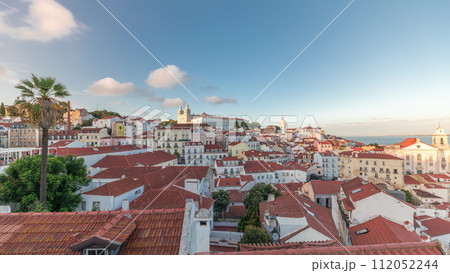 Panorama showing aerial view of Alfama in Lisbon timelapse during sunset. 112052244