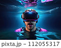Young man wearing virtual reality glasses under the water. Concept of dive into the Metaverse. 112055317