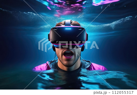 Young man wearing virtual reality glasses under the water. Concept of dive into the Metaverse. 112055317