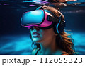 Young woman wearing virtual reality glasses under the water. Concept of dive into the Metaverse. 112055323