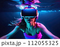 Young woman wearing virtual reality glasses under the water. Concept of dive into the Metaverse. 112055325