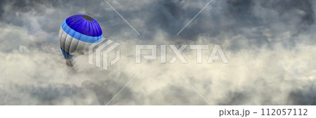 Serene Ascent: Hot Air Balloon Drifting Above a Sea of Clouds 112057112