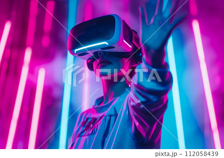 Video gaming player in VR headset playing virtual reality games in 3D VR equipment Video gaming player in VR headset playing virtual reality games in 3D VR equipment 112058439