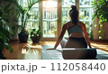 Woman practicing flexible yoga poses and mindful spiritual meditation relaxation 112058440