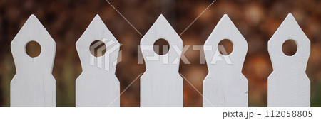 Banner detailed view of white picket fence Banner detailed view of white picket fence 112058805